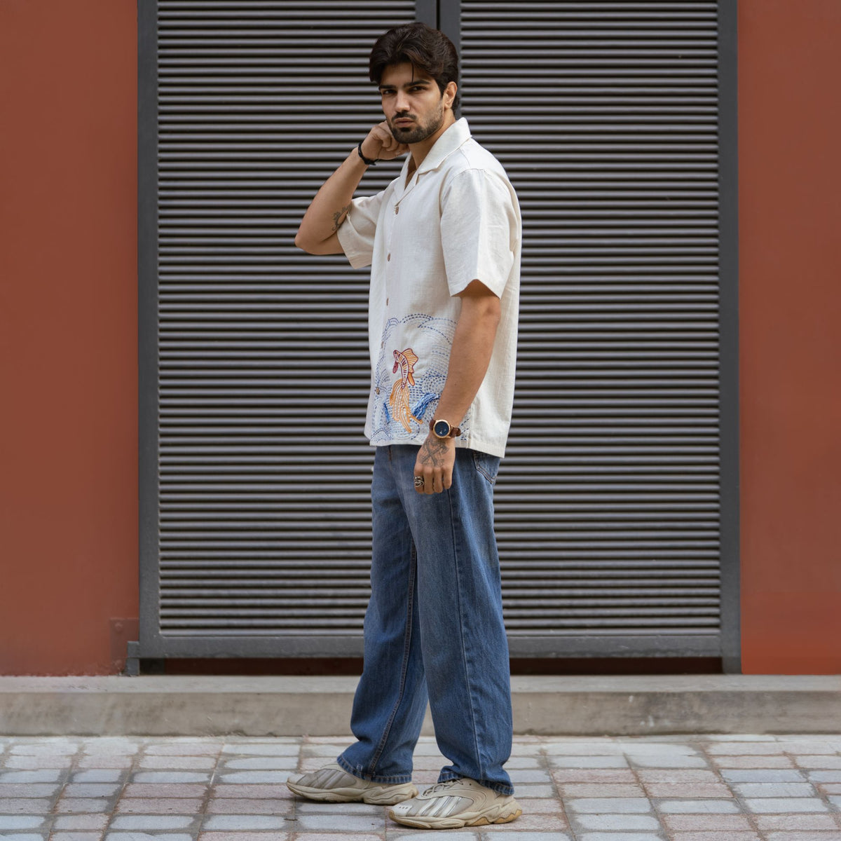 Fish & Flow shirt side view showing embroidered hem