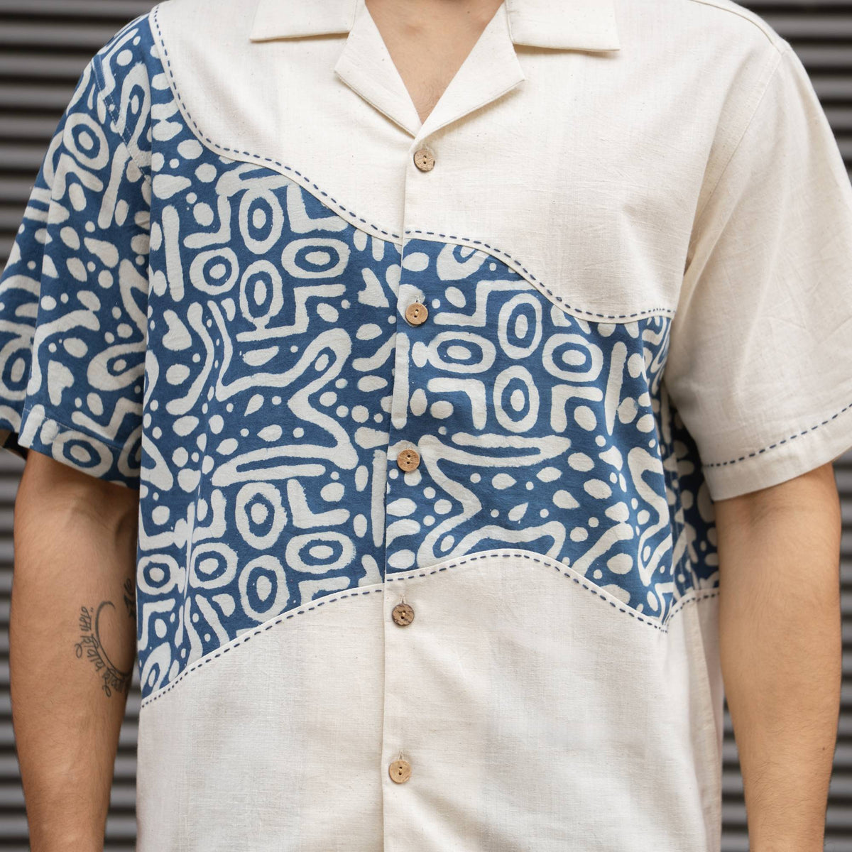Close-up of Dabu block print, Kantha stitching and coconut shell buttons