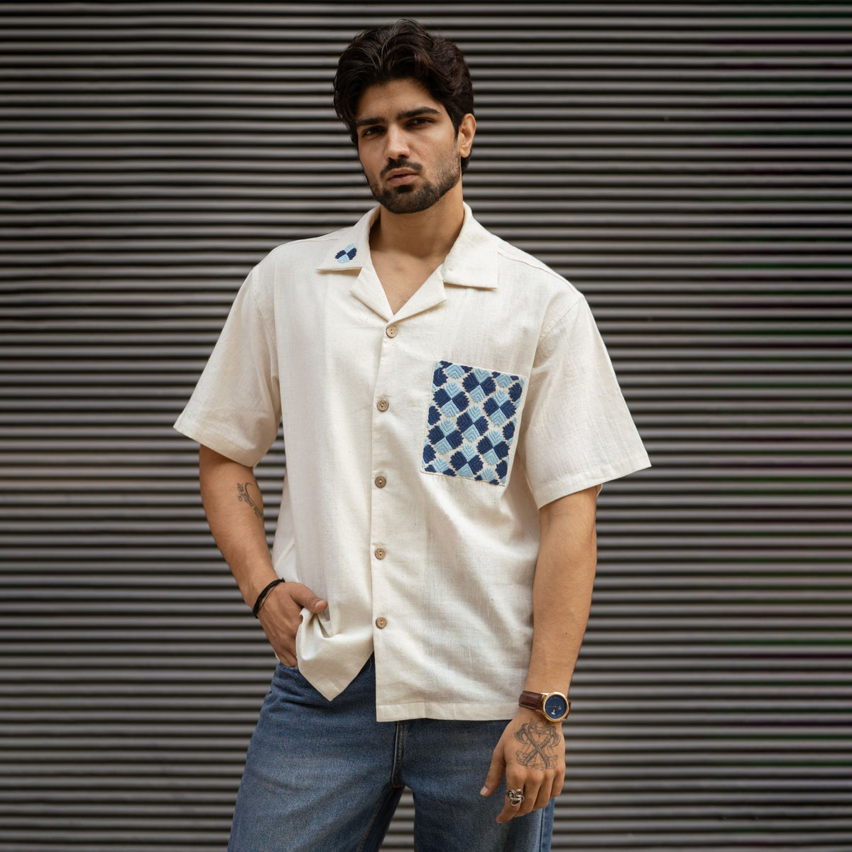 Phulkari Khadi Cuban collar shirt with hand-embroidered blue pocket, front view