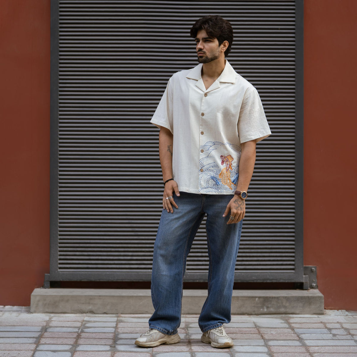Fish & Flow shirt styled with blue denim, full length