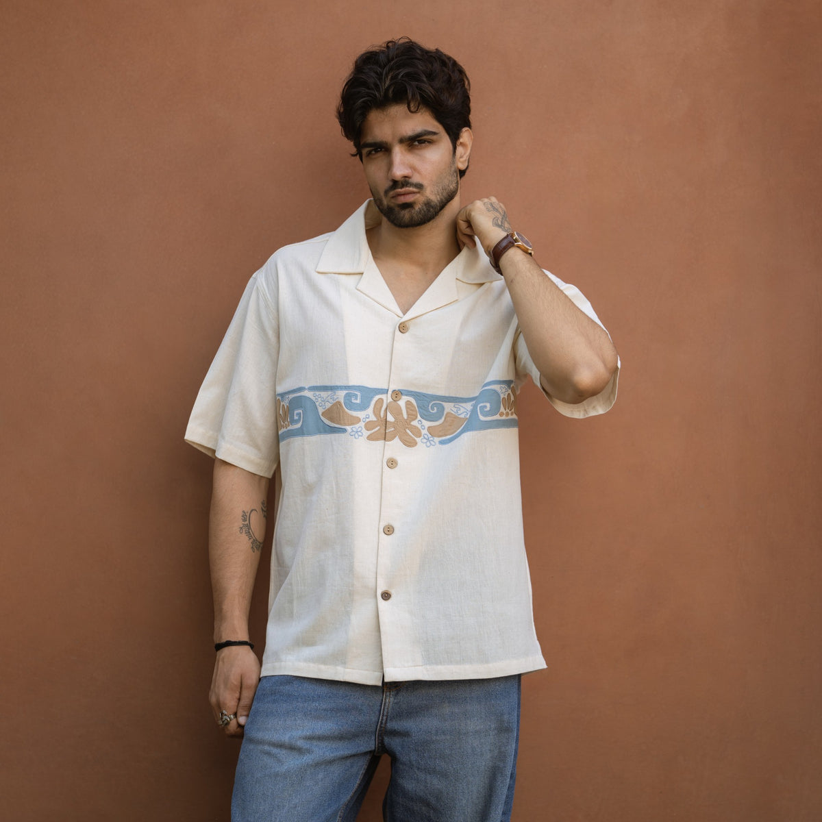 Sea Drift ecru khadi shirt front, hand-appliqued sea-life border and coconut wood buttons