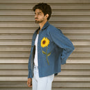 Side view of relaxed fit denim shaket jacket with embroidered sunflower and metal buttons