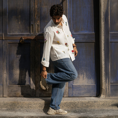 Valley of Blooms embroidered floral shirt styled with blue denim and sneakers