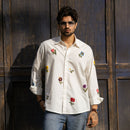 Valley of Blooms white cotton-linen hand embroidered floral shirt, front view with denim